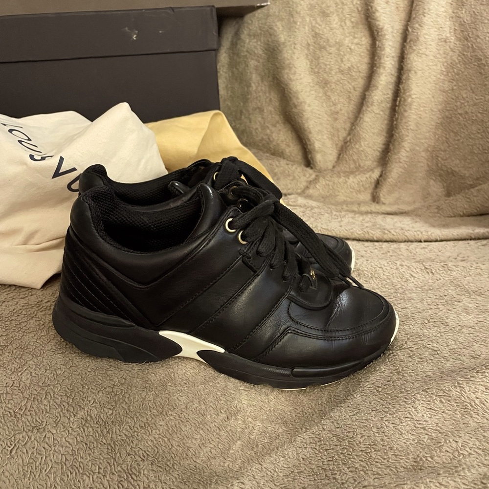 CHANEL Black Leather Low-Top Sneakers with White Accent